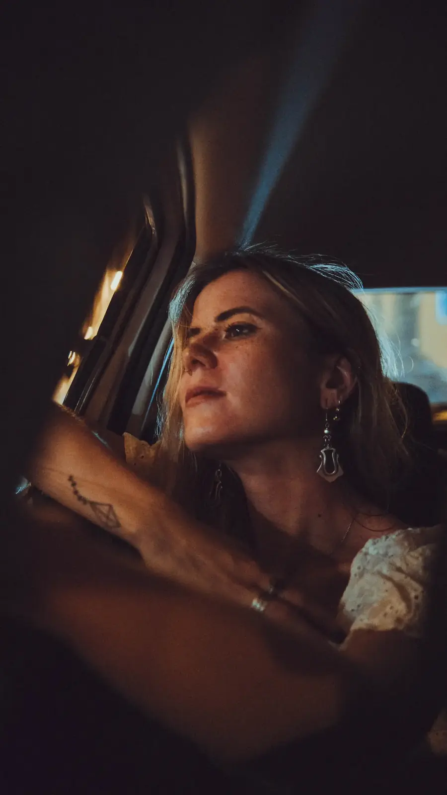 Atmospheric natural portrait framed by city lights